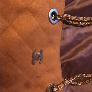 Rust colored shoulder bag with a chain